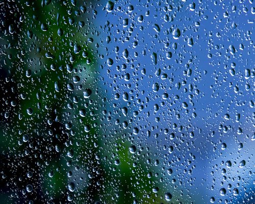 Glass of water near a window to promote hydration